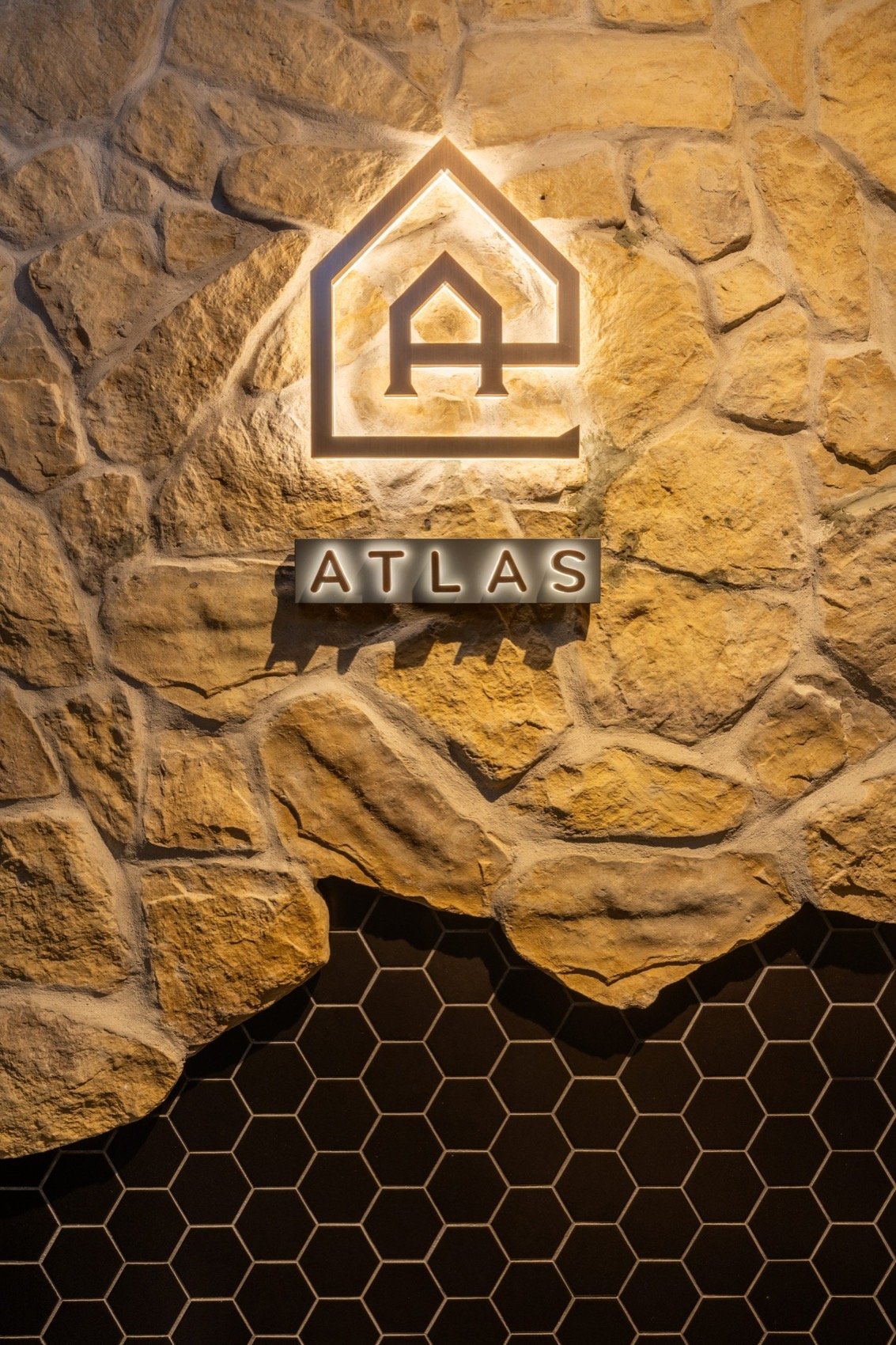 Atlas stone logo wall