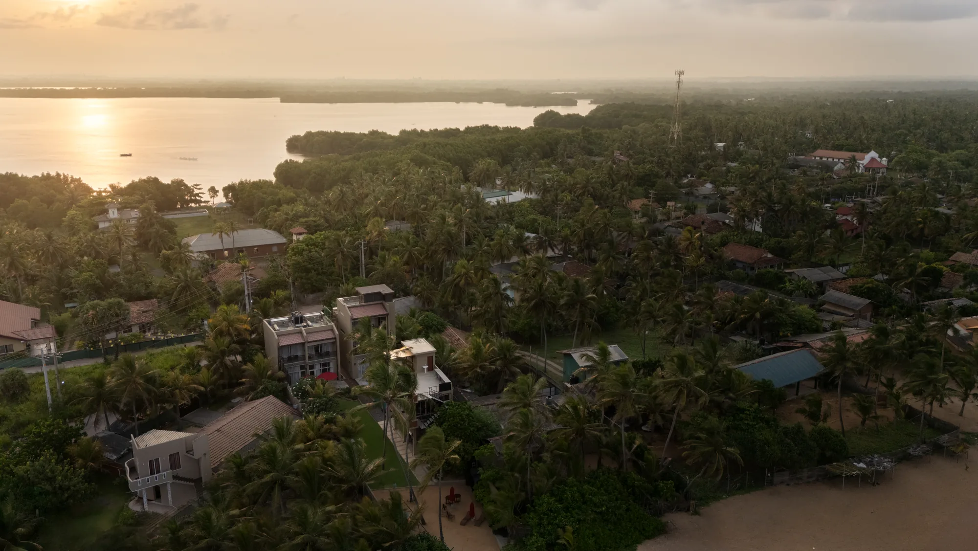 AYUDA Sanctuary Boutique, aerial over the lagoon at sunset